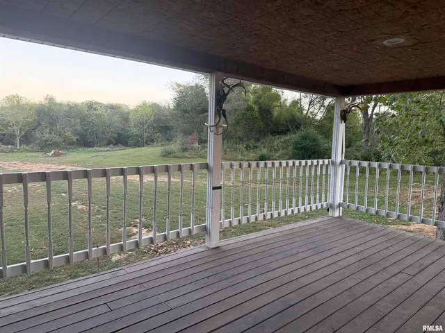 a view of a balcony with wooden floor
