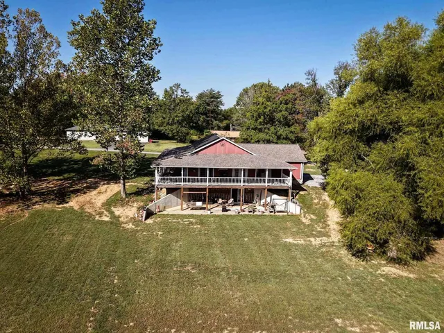 a house with swimming pool in front of it