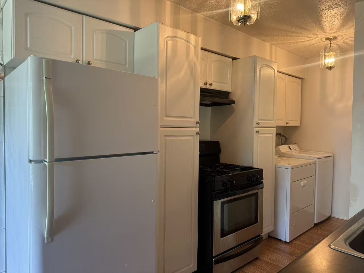 1326 Inverrary Lane, Unit 1326 Deerfield, IL 60015 - Photo 5 of 15 a white refrigerator freezer and a stove sitting inside of a kitchen