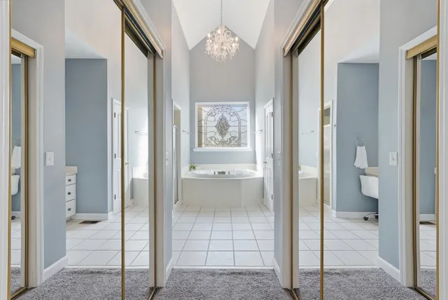 a bathroom with a glass shower door