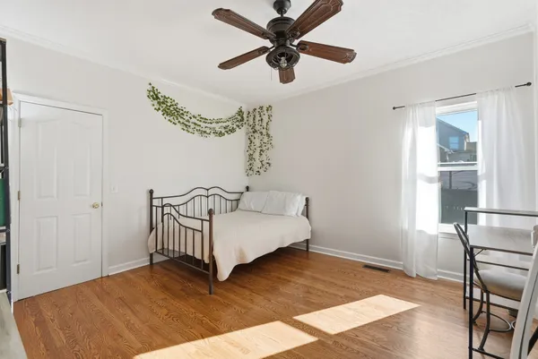 a bed room with a bed and a window