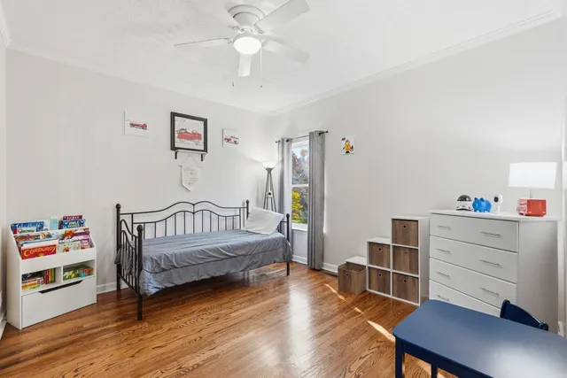 a bedroom with furniture and a window