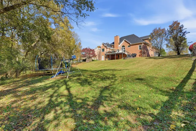 a view of a garden with a house