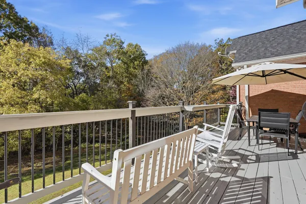 a view of balcony with furniture