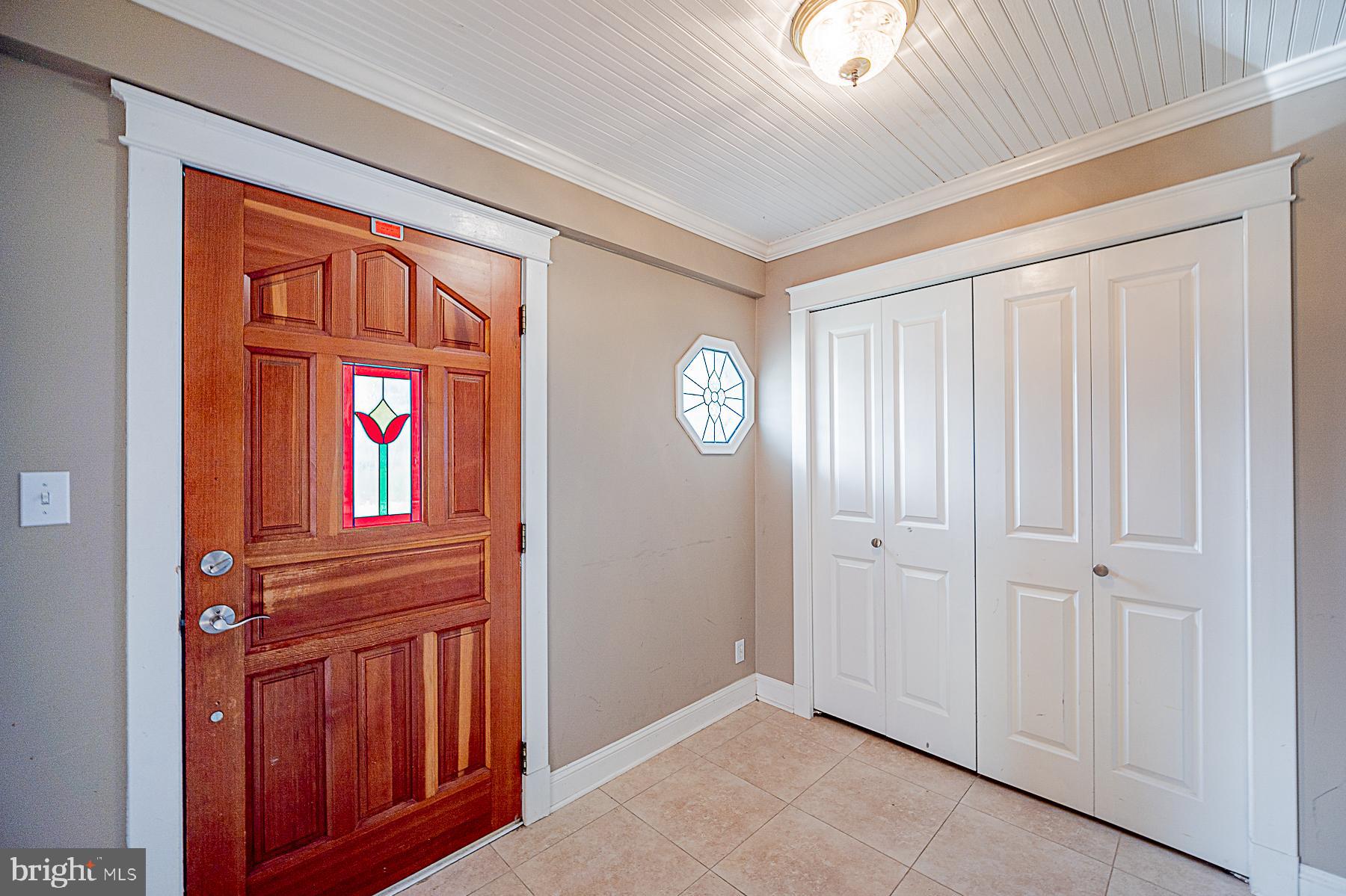 5565 Ashbourne Road Baltimore, MD 21227 - Photo 6 of 47 FOYER WITH COAT CLOSET