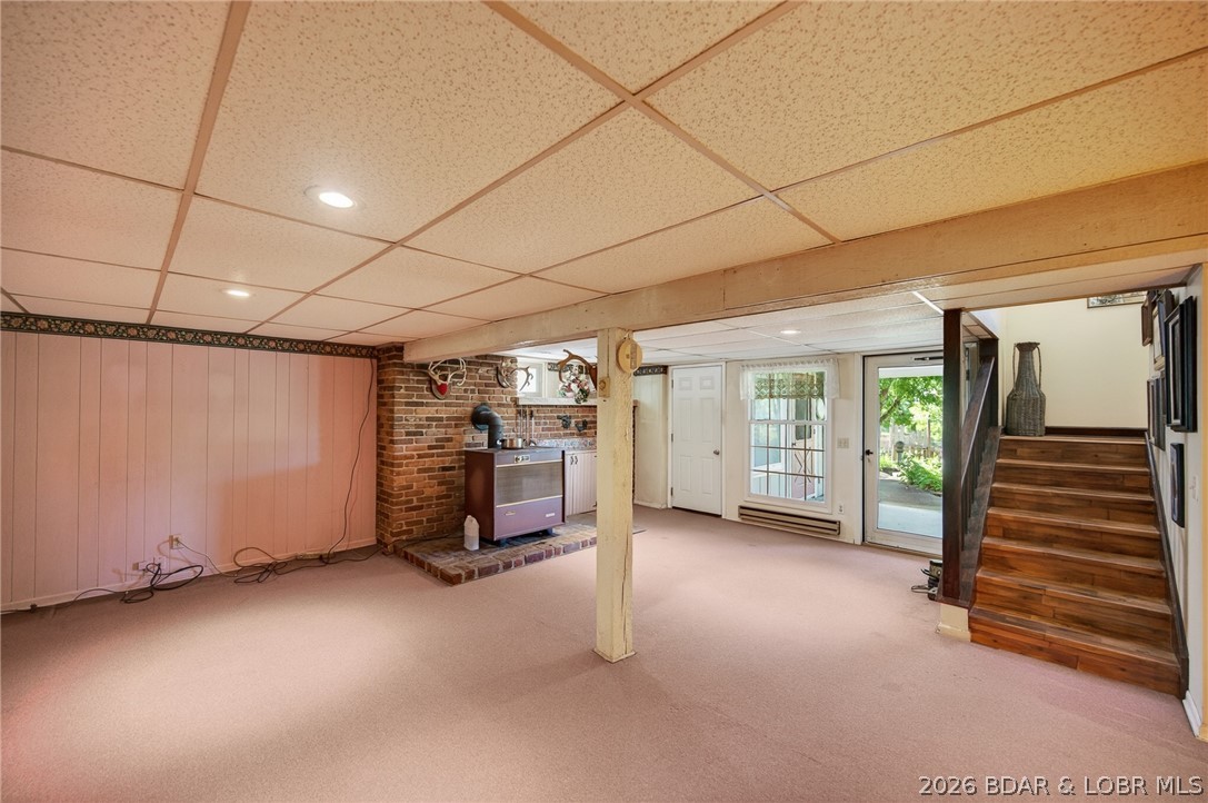 108 Dunwurkin Road Laurie, MO 65037 - Photo 37 of 63 Walkout basement with wood burning stove and radia