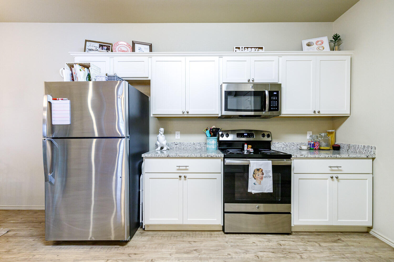 6702 Pontiac Avenue Lubbock, TX 79424 - Photo 16 of 41 a kitchen with a refrigerator and a stove