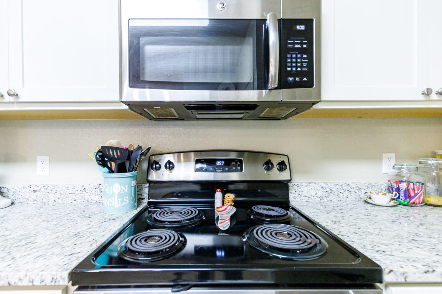 6702 Pontiac Avenue Lubbock, TX 79424 - Photo 17 of 41 a kitchen with a stove and a microwave