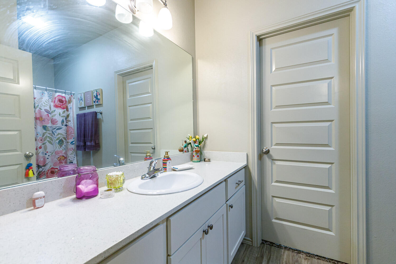 6702 Pontiac Avenue Lubbock, TX 79424 - Photo 25 of 41 a bathroom with a sink vanity and a mirror