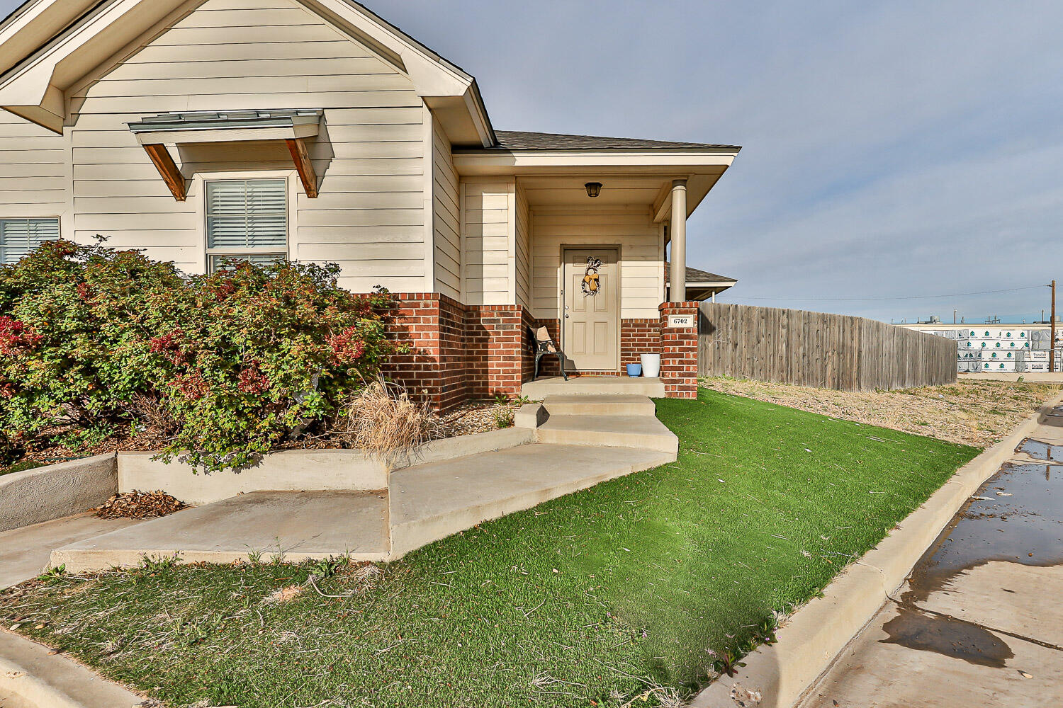 6702 Pontiac Avenue Lubbock, TX 79424 - Photo 3 of 41 a view of a house with a yard and sitting area