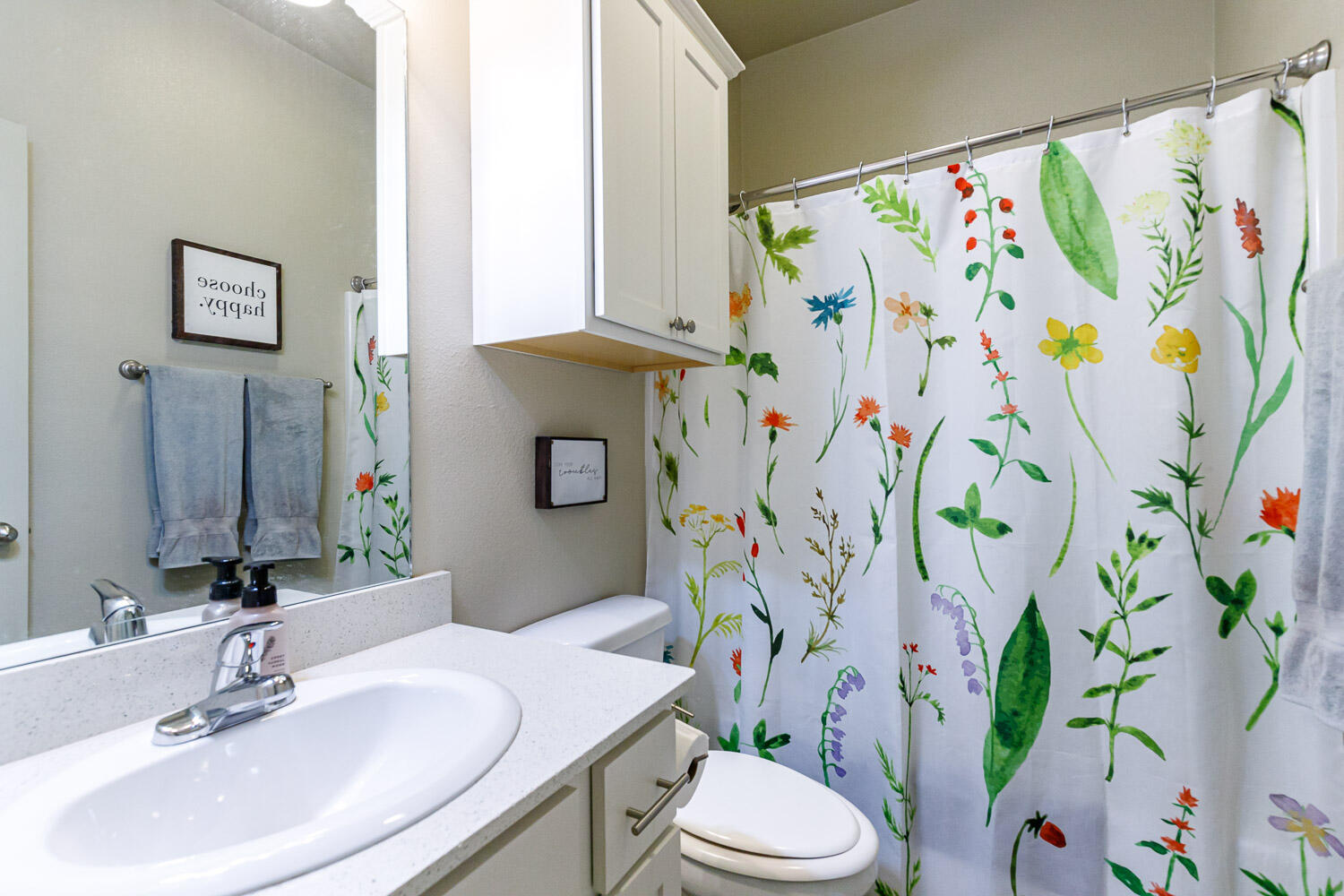 6702 Pontiac Avenue Lubbock, TX 79424 - Photo 31 of 41 a bathroom with a sink a toilet and a mirror