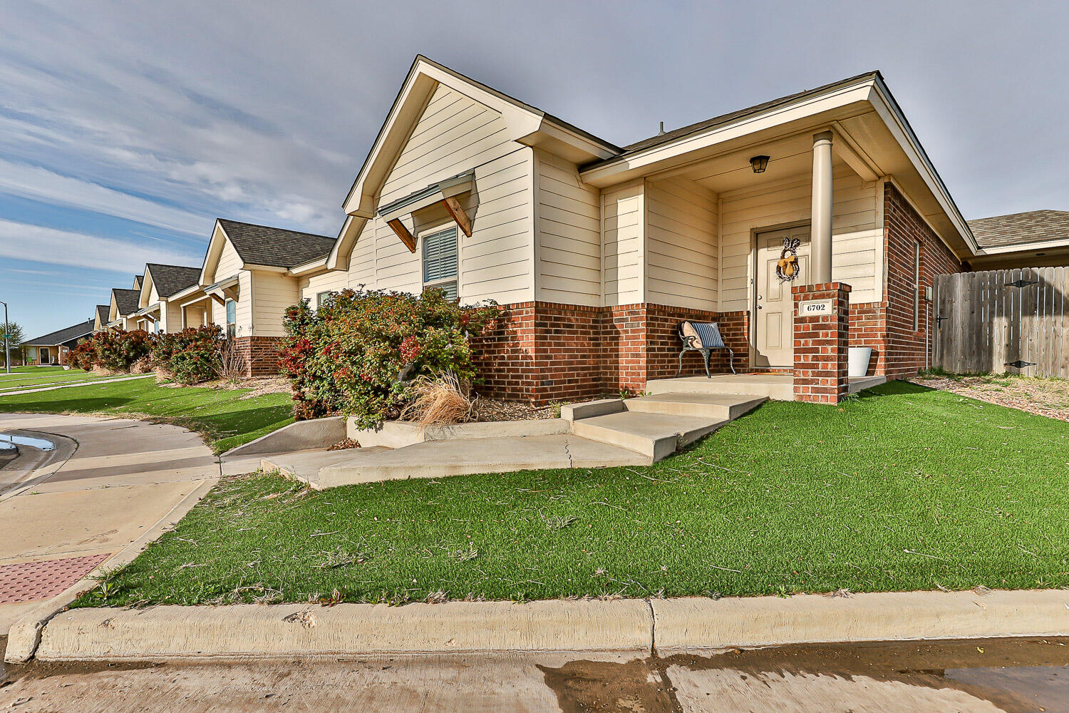 6702 Pontiac Avenue Lubbock, TX 79424 - Photo 4 of 41 a front view of a house with a yard