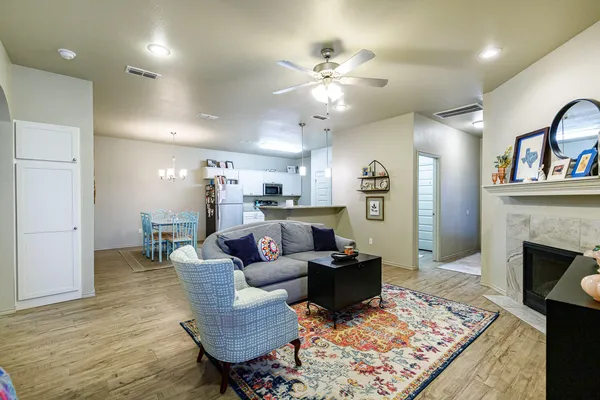 a living room with furniture and a fireplace