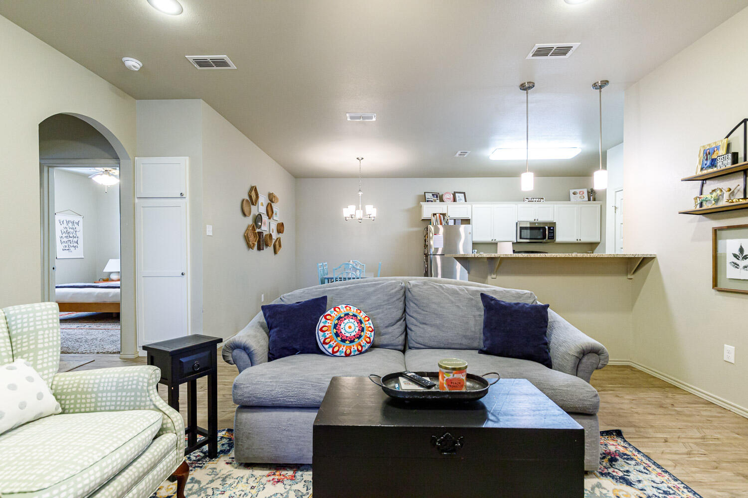 6702 Pontiac Avenue Lubbock, TX 79424 - Photo 9 of 41 a living room with furniture and wooden floor