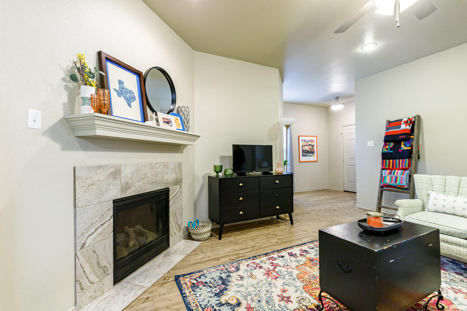 6702 Pontiac Avenue Lubbock, TX 79424 - Photo 10 of 41 a living room with furniture and a fireplace