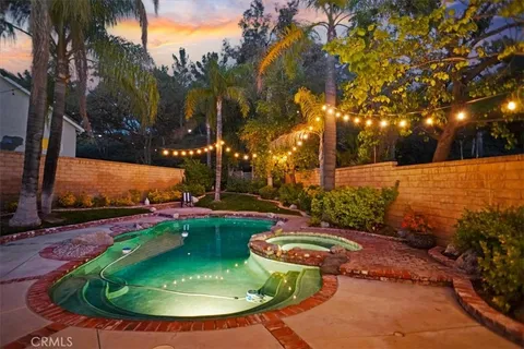 a backyard with table and chairs