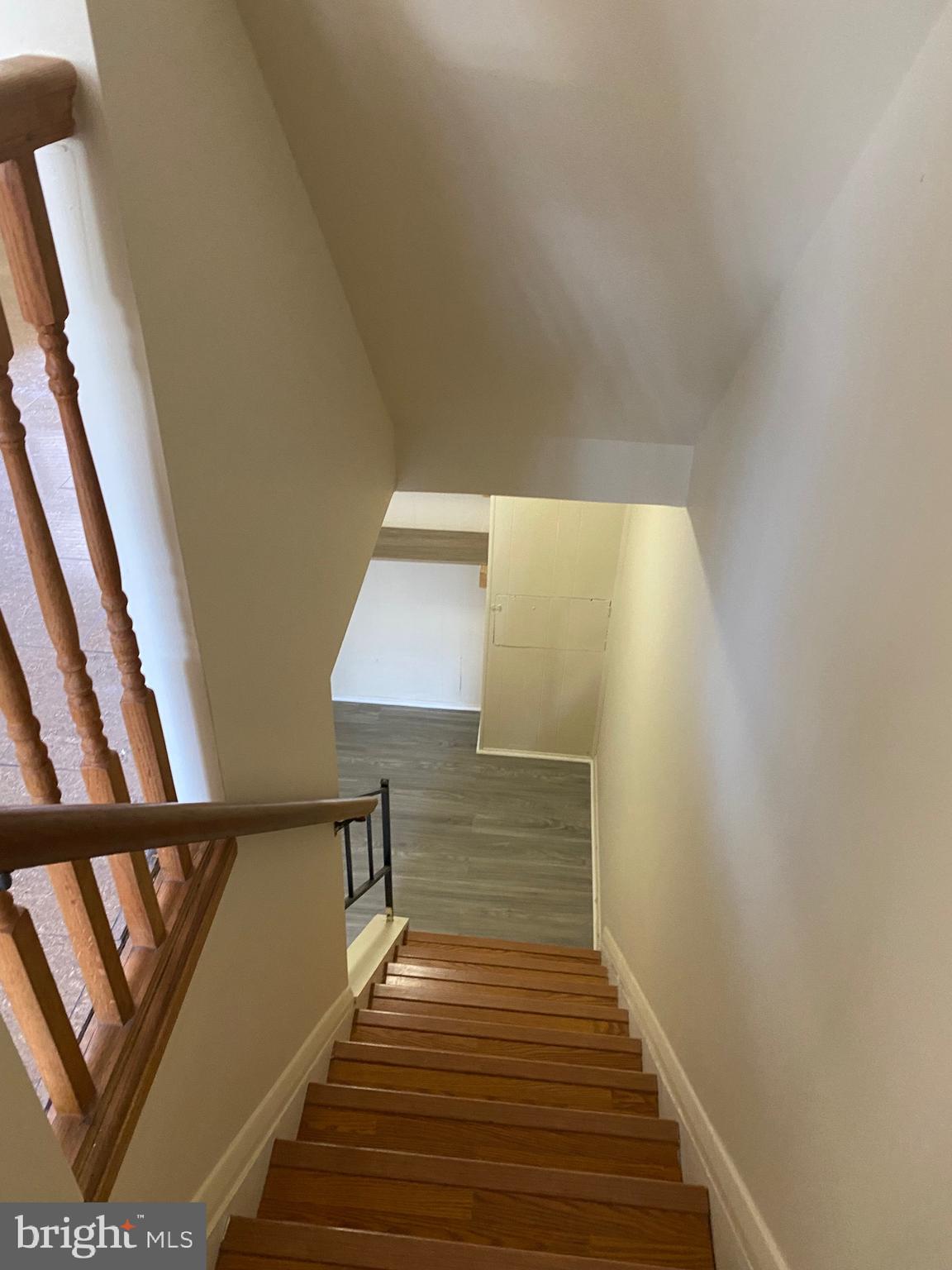 9323 Matador Road Columbia, MD 21045 - Photo 11 of 14 a view of entryway and hall with wooden floor