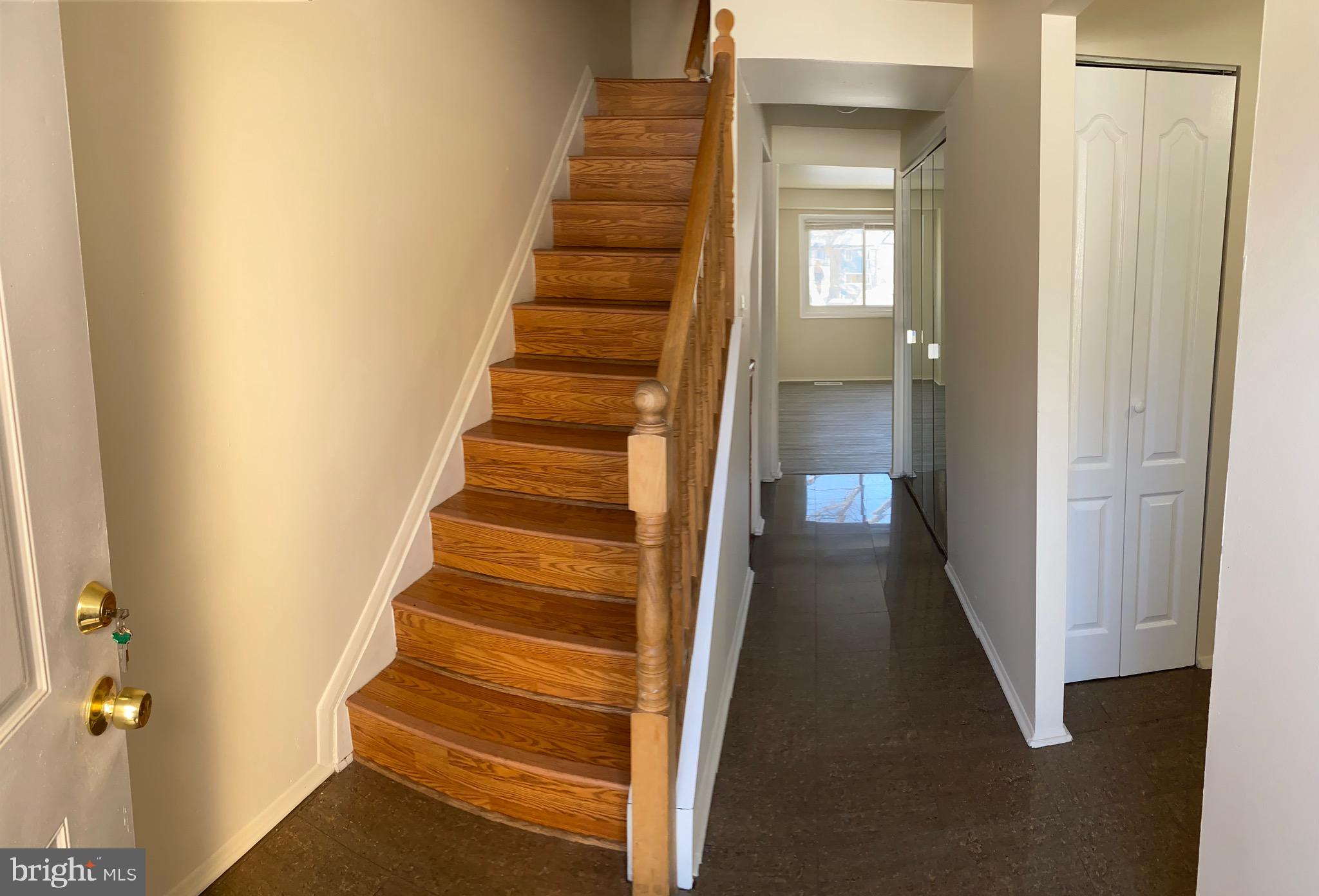 9323 Matador Road Columbia, MD 21045 - Photo 3 of 14 a view of a hallway with wooden walls and entryway