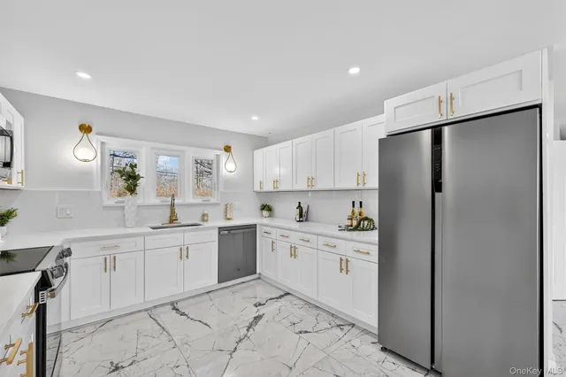a bathroom with a sink toilet and a mirror