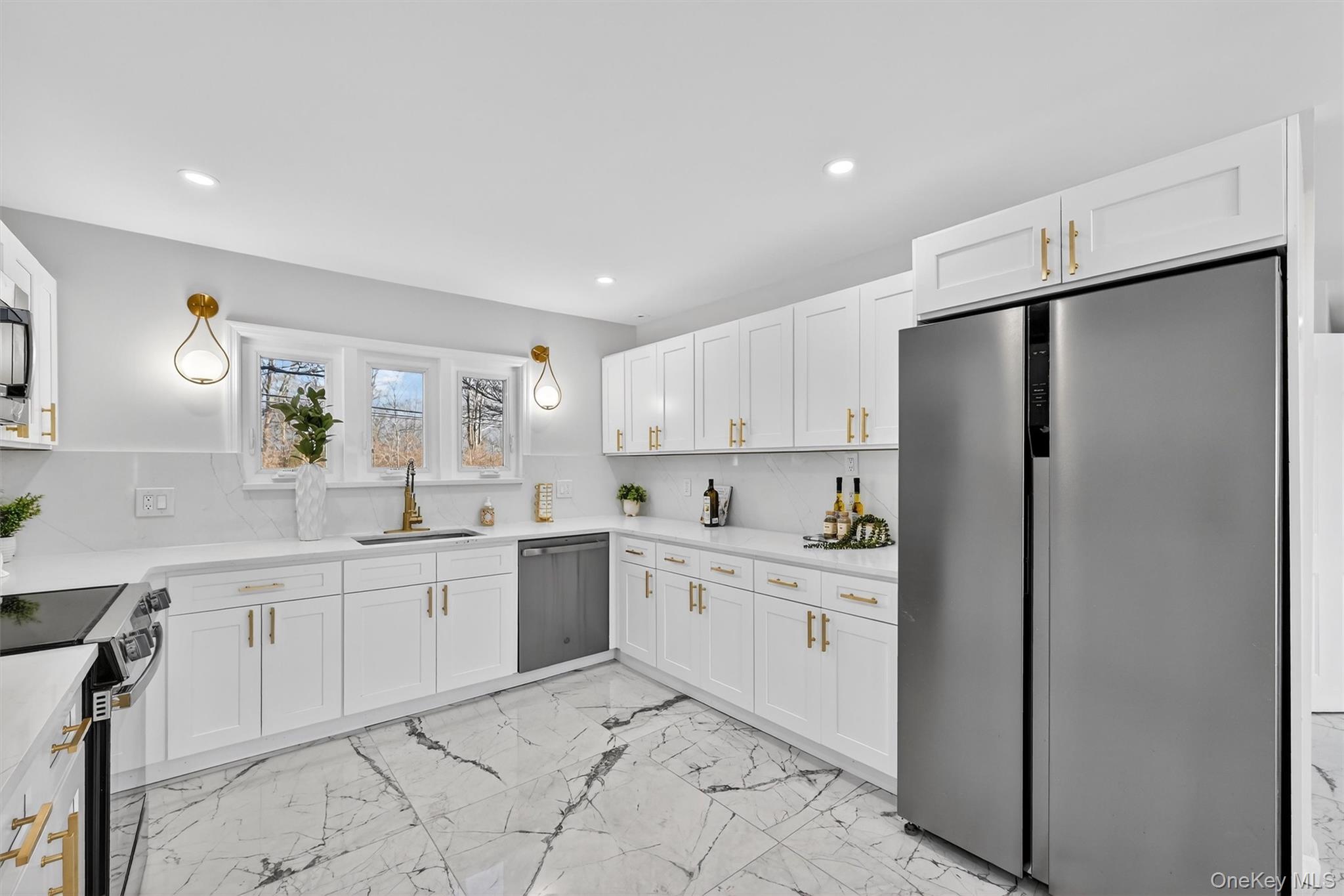 503 Station Road Rock Tavern, NY 12575 - Photo 11 of 47 Kitchen featuring stainless steel appliances, light marble finish floors, white cabinetry, light stone counters, and recessed lighting