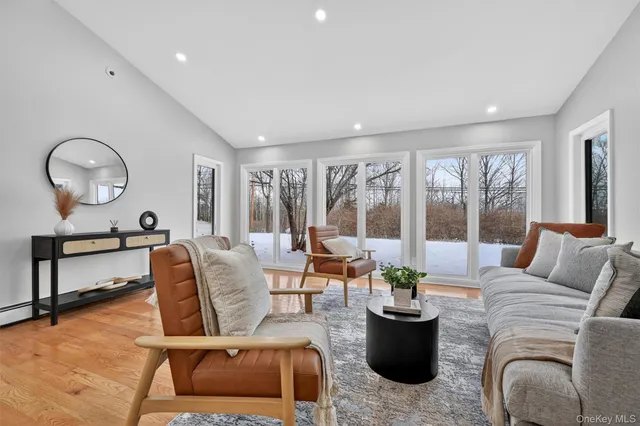 a view of backyard with a deck and wooden floor