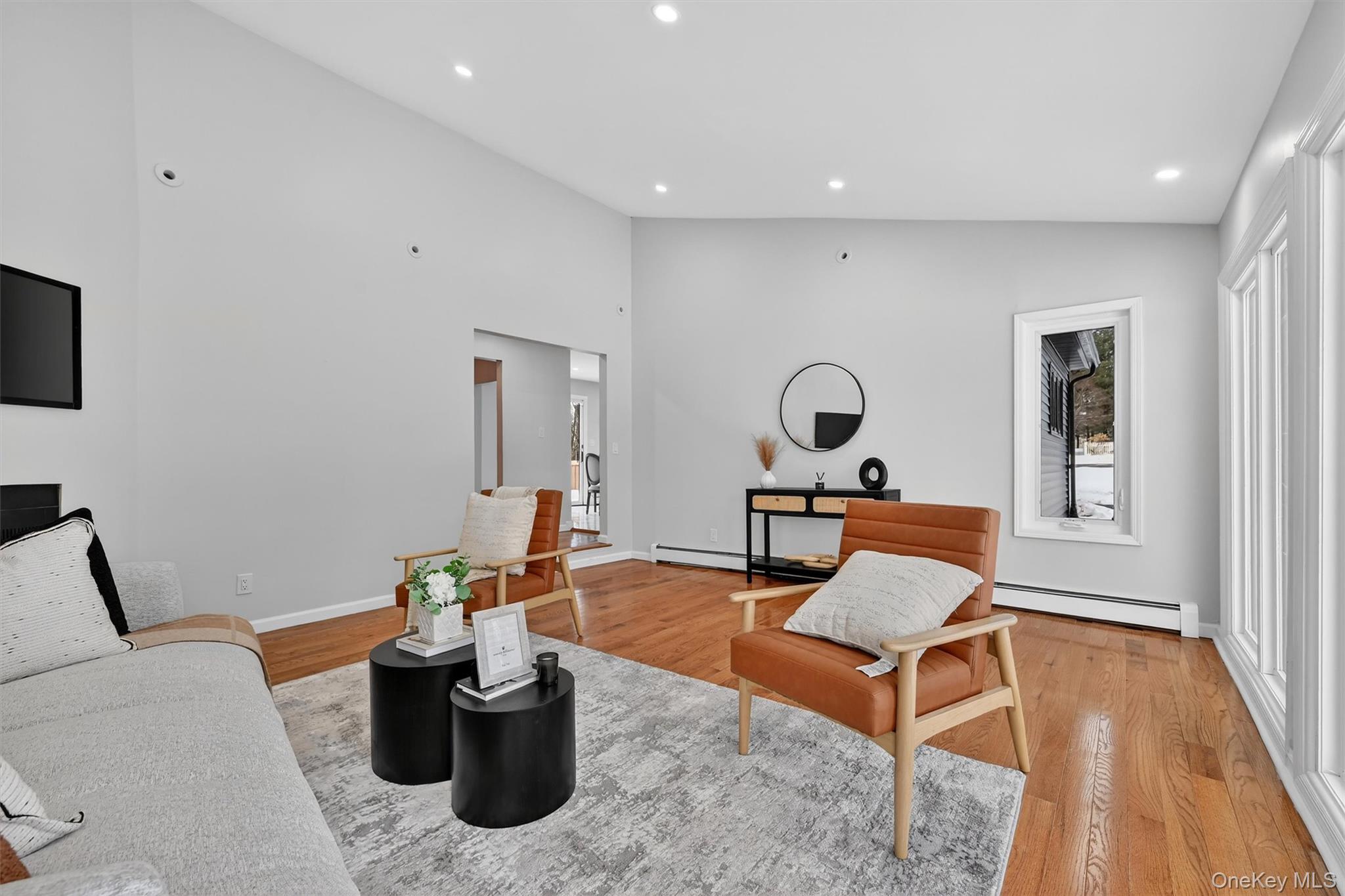 503 Station Road Rock Tavern, NY 12575 - Photo 17 of 47 Living area with recessed lighting, a baseboard radiator, light wood-style flooring, and lofted ceiling
