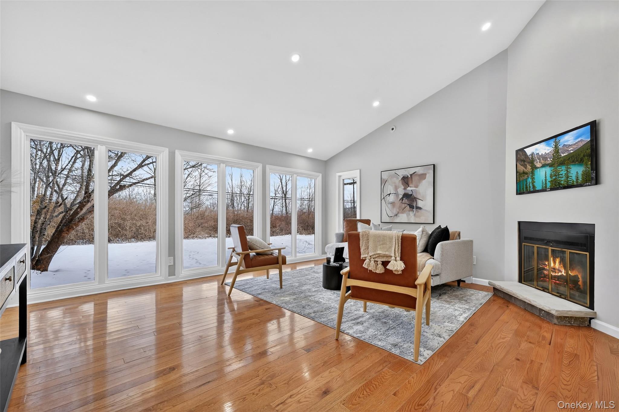 503 Station Road Rock Tavern, NY 12575 - Photo 18 of 47 Sitting room featuring a glass covered fireplace, light wood-type flooring, recessed lighting, and high vaulted ceiling