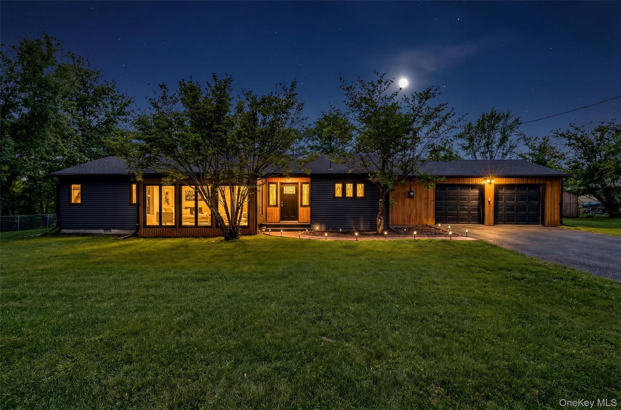 503 Station Road Rock Tavern, NY 12575 - Photo 2 of 47 View of front facade with a front yard, asphalt driveway, and an attached garage