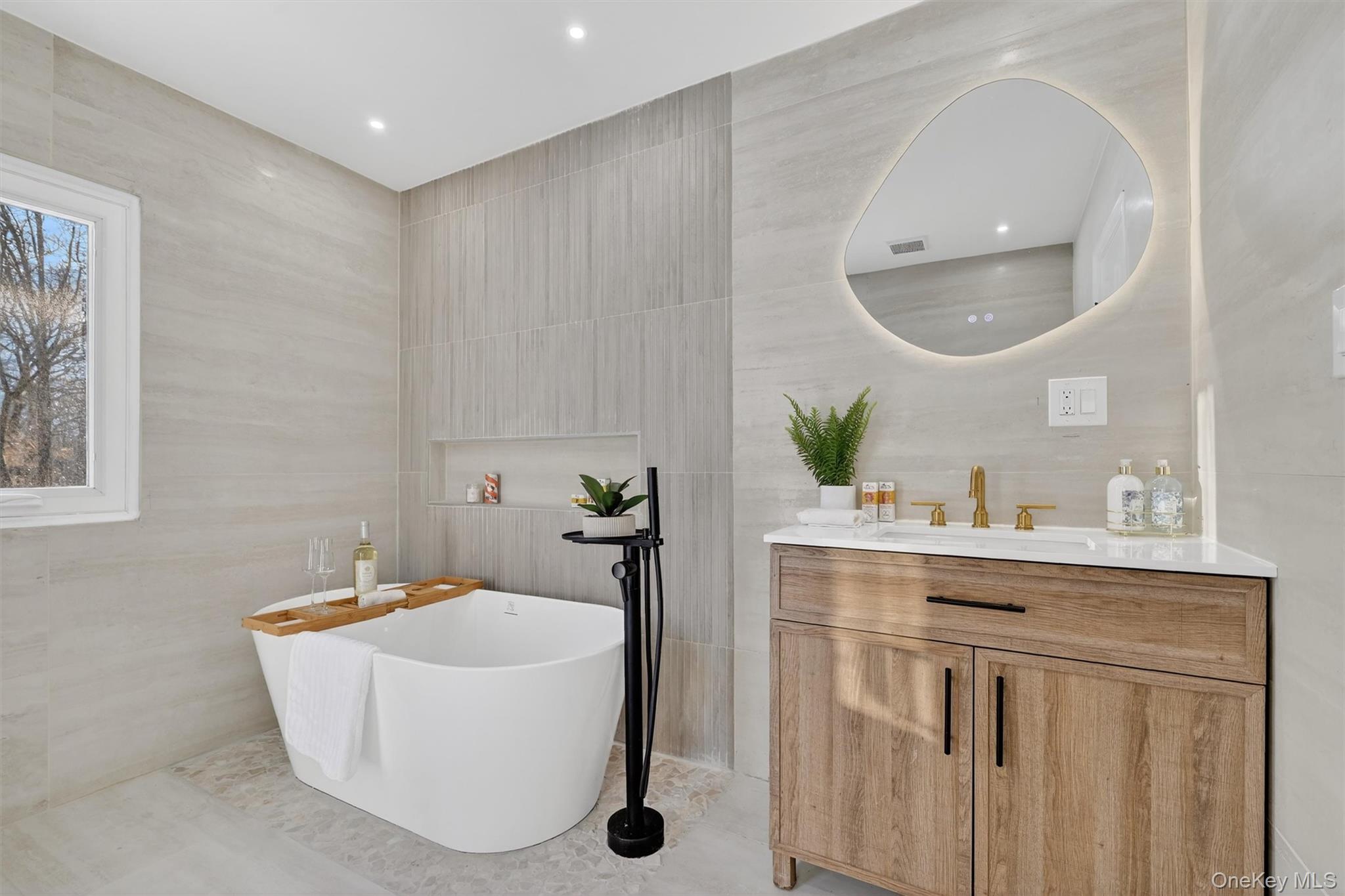503 Station Road Rock Tavern, NY 12575 - Photo 29 of 47 Bathroom with vanity, a soaking tub, and tile walls