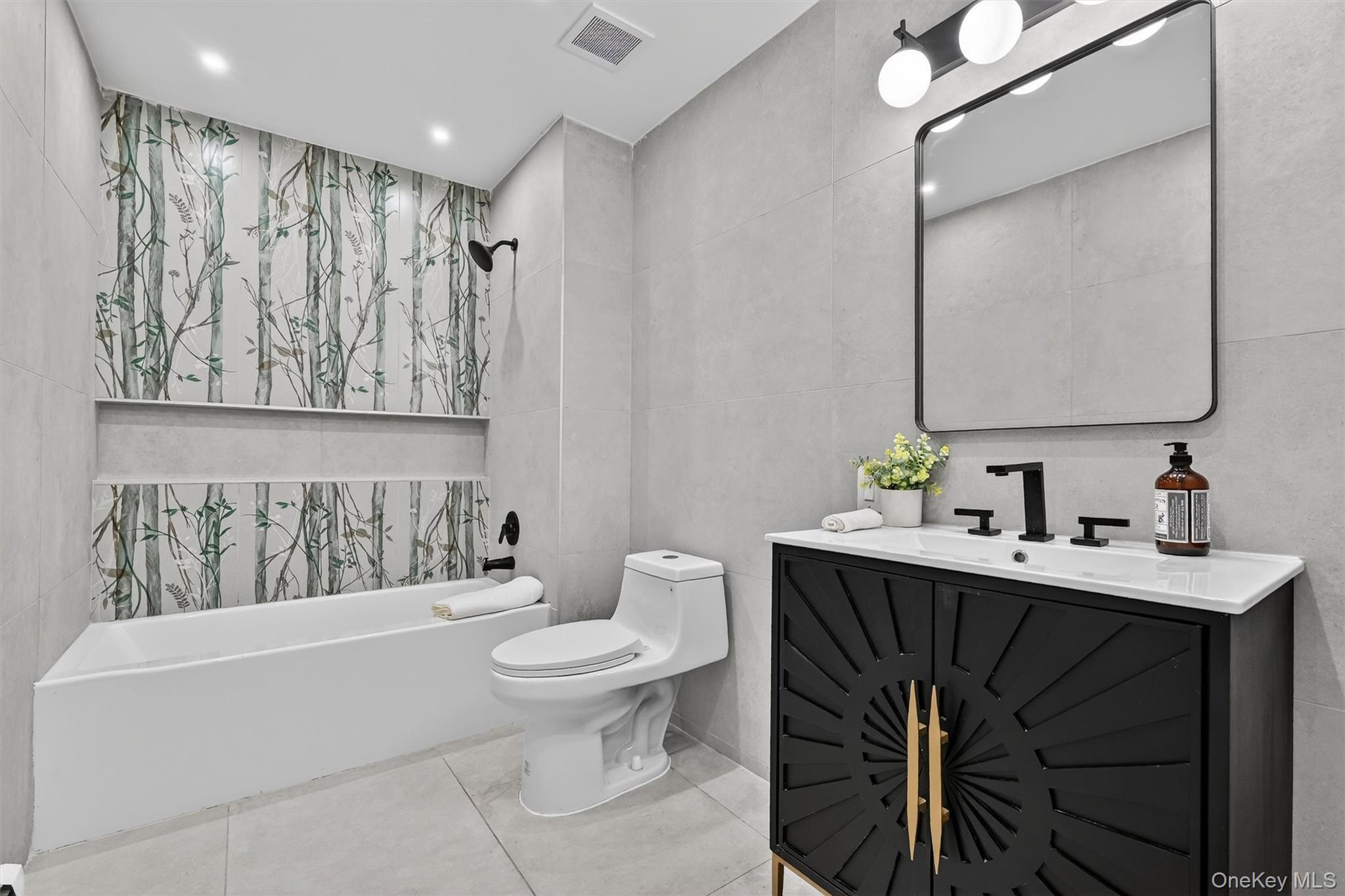 503 Station Road Rock Tavern, NY 12575 - Photo 31 of 47 Full bath with vanity, washtub / shower combination, tile walls, and light tile patterned floors