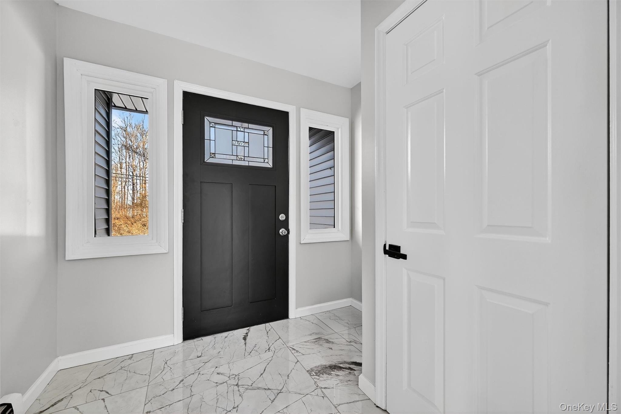 503 Station Road Rock Tavern, NY 12575 - Photo 37 of 47 Entryway featuring light marble finish floors and baseboards
