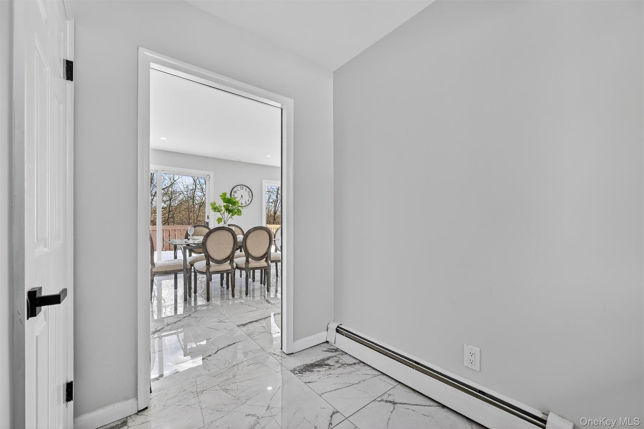 503 Station Road Rock Tavern, NY 12575 - Photo 38 of 47 Empty room featuring a baseboard heating unit, light marble finish floors, and recessed lighting