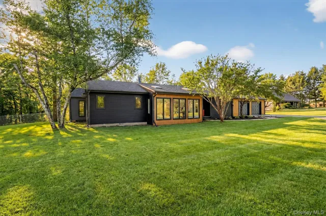 a kitchen with white cabinets stainless steel appliances and sink