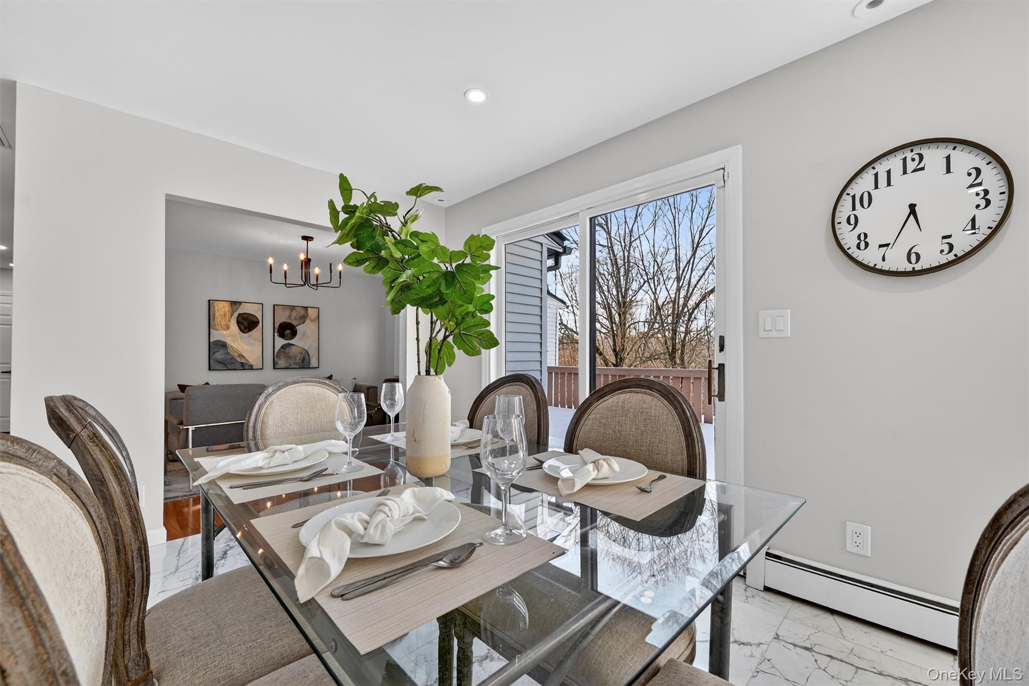 503 Station Road Rock Tavern, NY 12575 - Photo 9 of 47 Dining area featuring light marble finish flooring, a baseboard heating unit, recessed lighting, and a chandelier