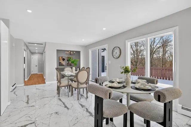 a bedroom with a large bed and a painting on the wall