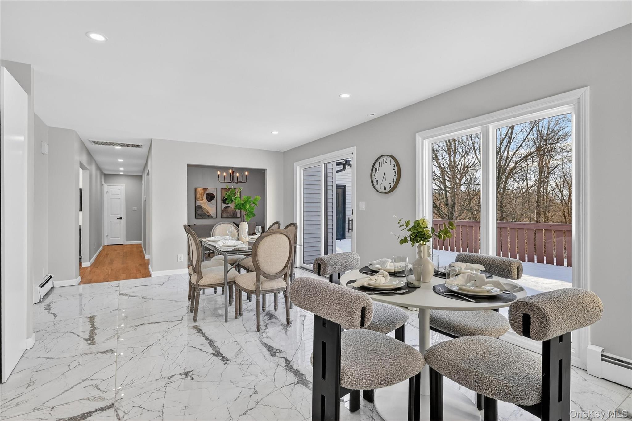 503 Station Road Rock Tavern, NY 12575 - Photo 10 of 47 Dining space featuring light marble finish floors, recessed lighting, a chandelier, and a baseboard heating unit