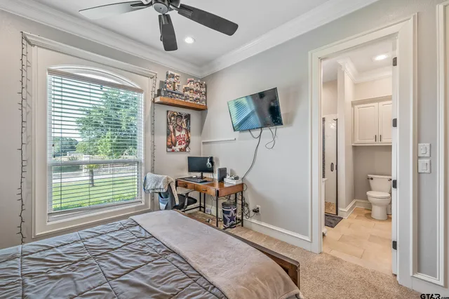 a bedroom with furniture and a window