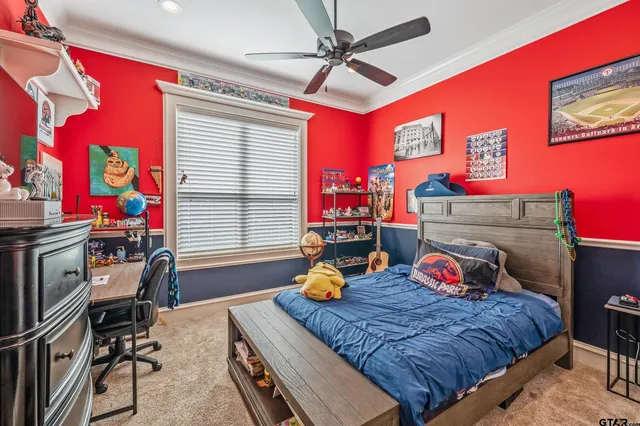 a bedroom with furniture and a window