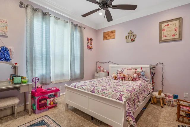 a bedroom with a bed and furniture