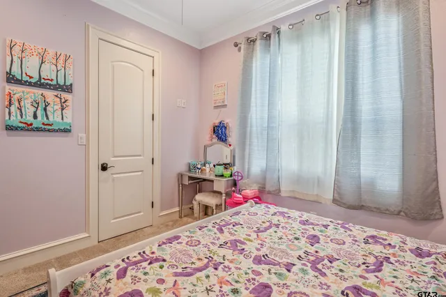 a bedroom with a bed and a closet