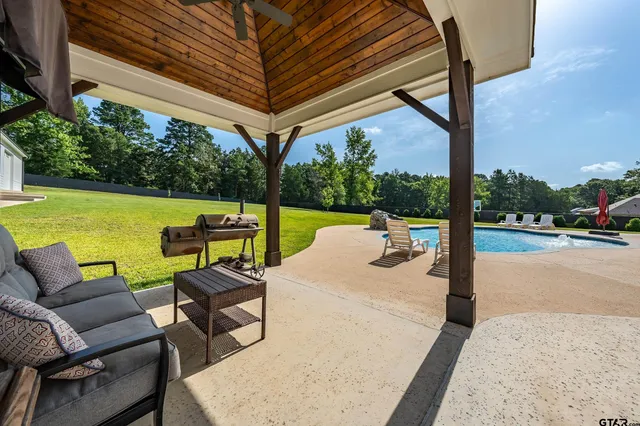 a view of swimming pool with a patio