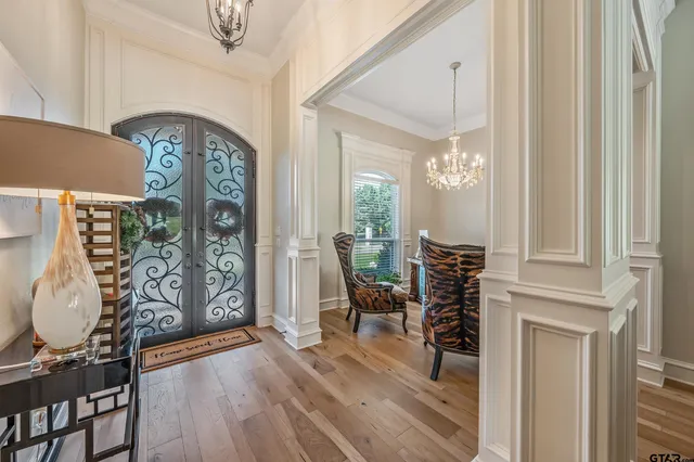 a view of a livingroom with furniture and hardwood floor