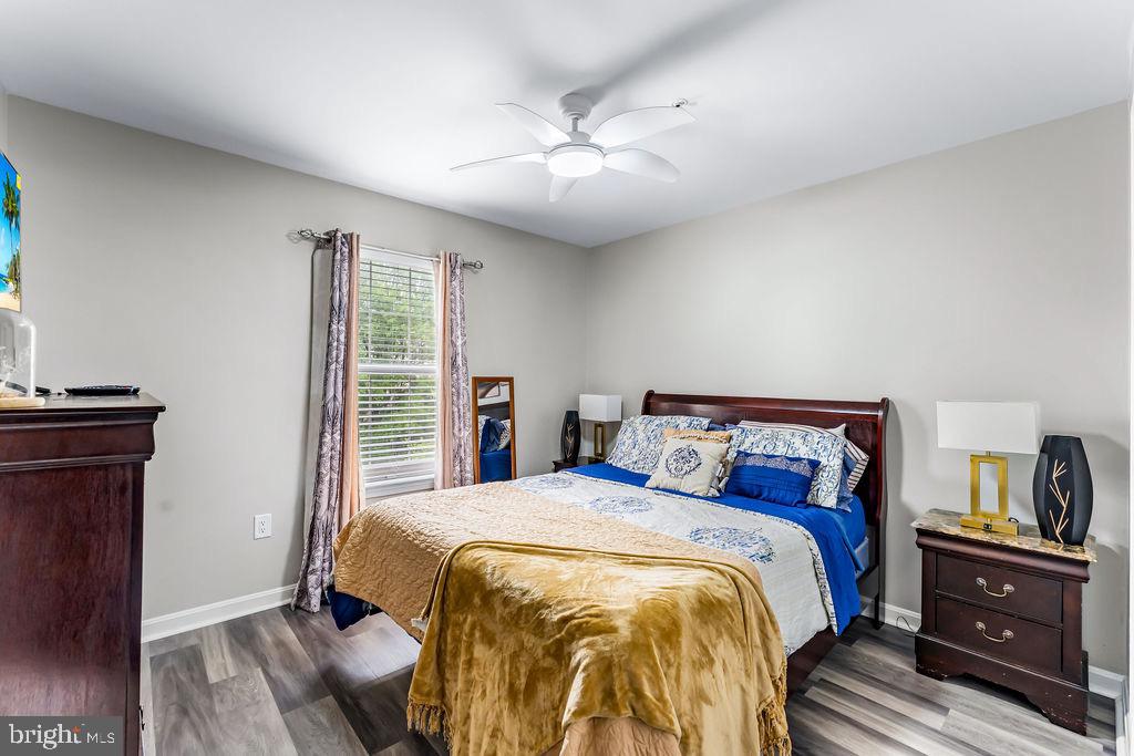11409 Hermosa Drive Laurel, MD 20708 - Photo 22 of 28 a bedroom with a bed and a tv