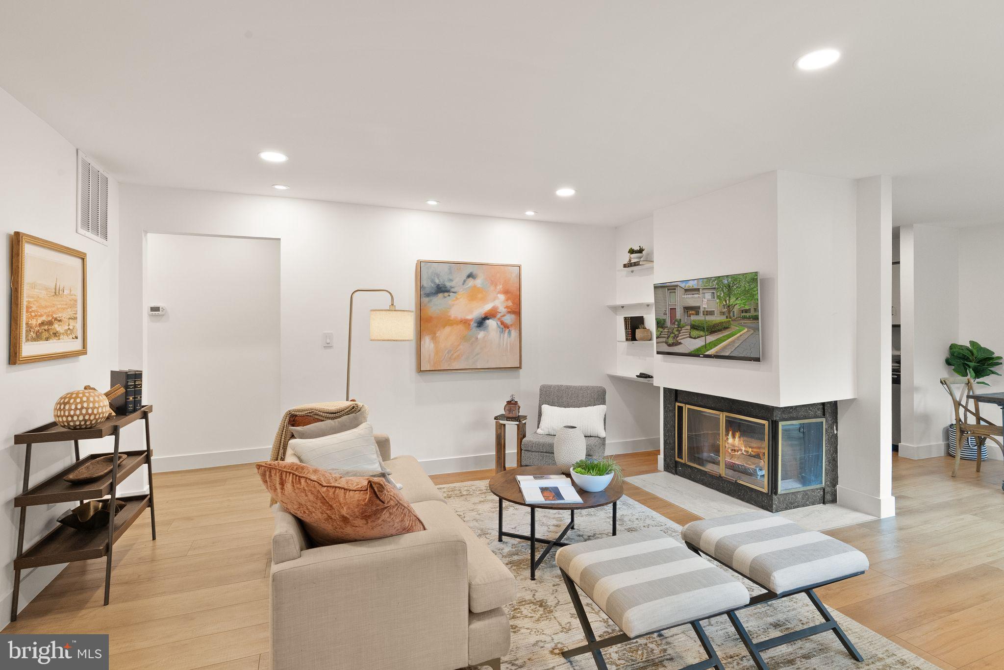 11025A Villaridge Court Reston, VA 20191 - Photo 4 of 38 Bright and open Living room w/ Fireplace