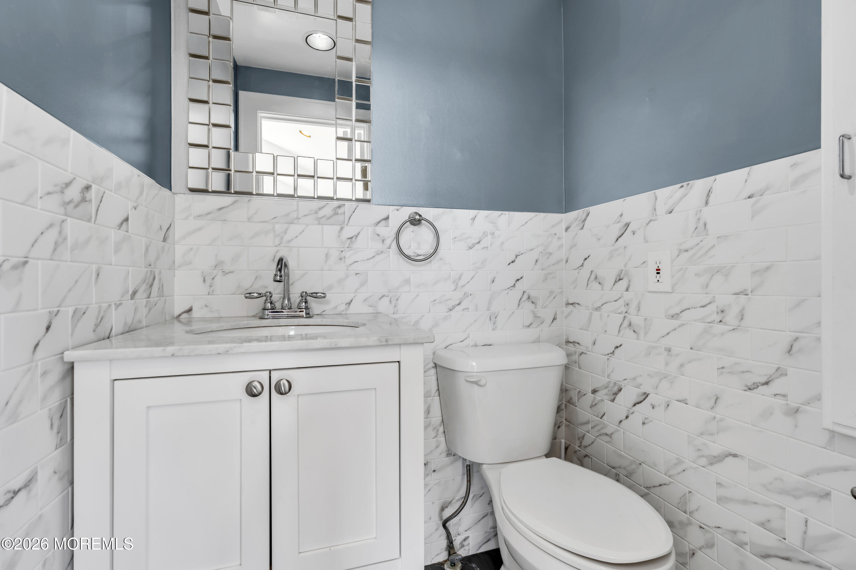 3 Royal Place Long Branch, NJ 07740 - Photo 14 of 23 a bathroom with a granite countertop toilet sink and mirror