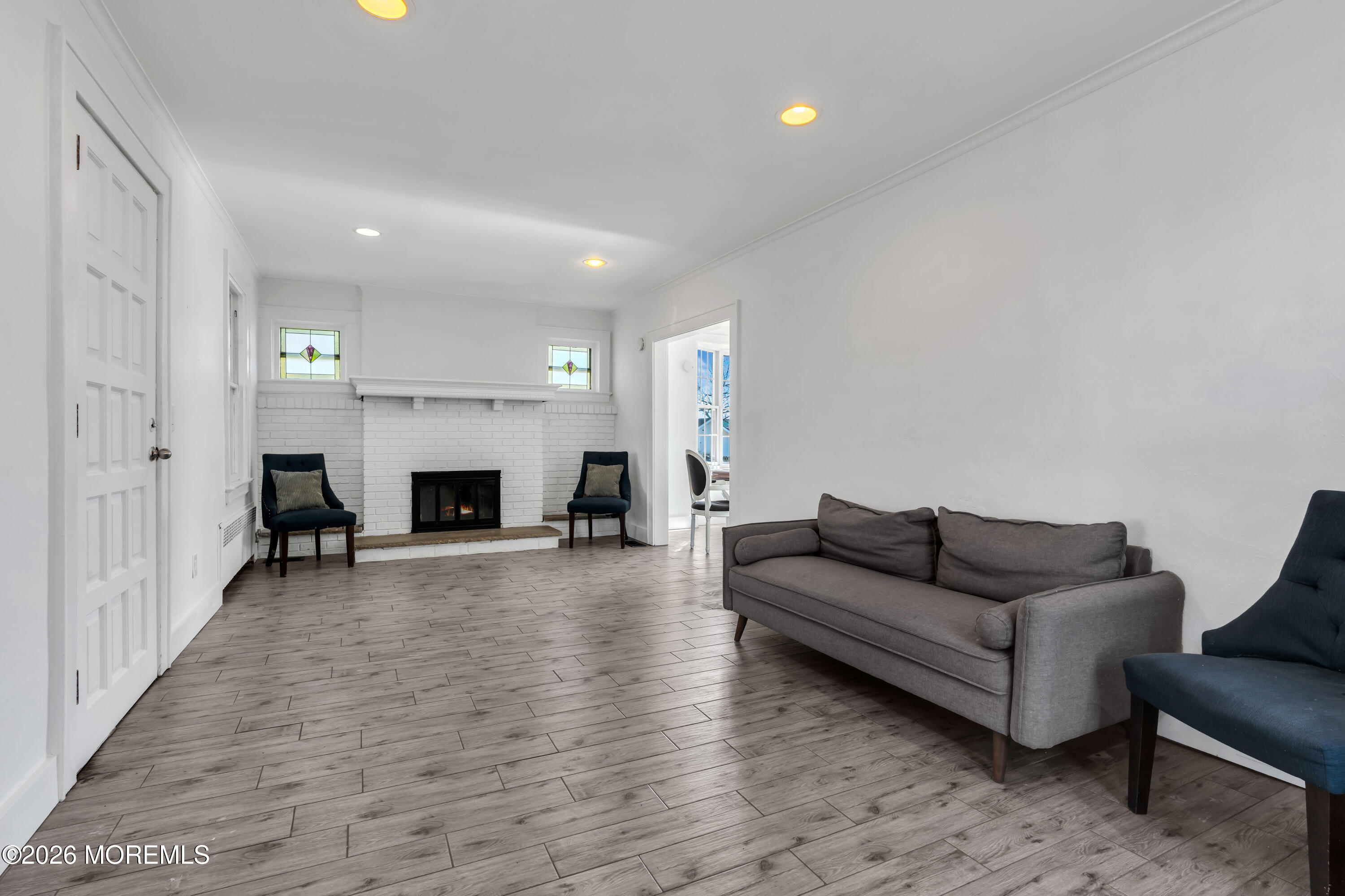 3 Royal Place Long Branch, NJ 07740 - Photo 5 of 23 a living room with furniture and a fireplace