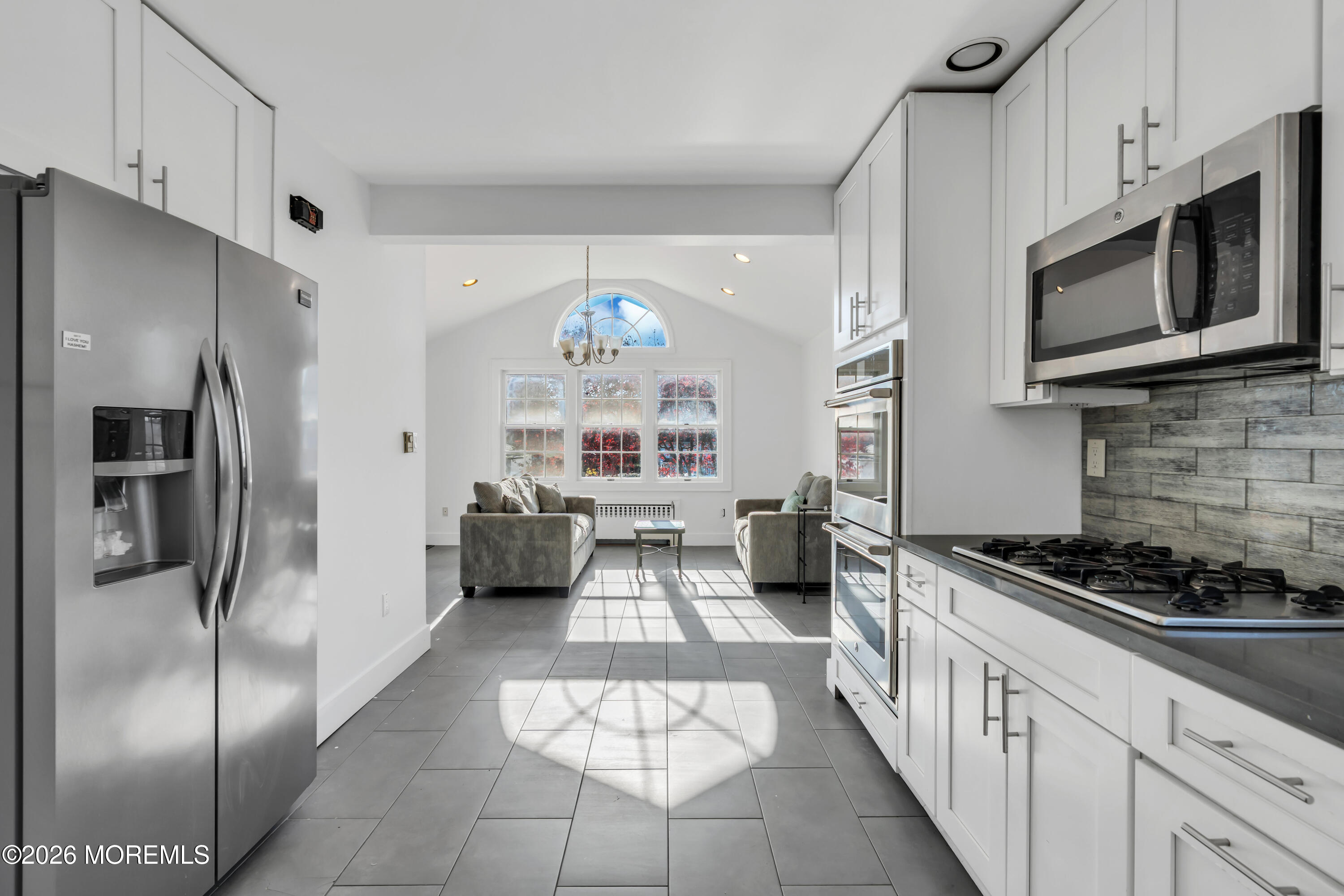3 Royal Place Long Branch, NJ 07740 - Photo 9 of 23 a kitchen with stainless steel appliances a refrigerator a stove a microwave and cabinets