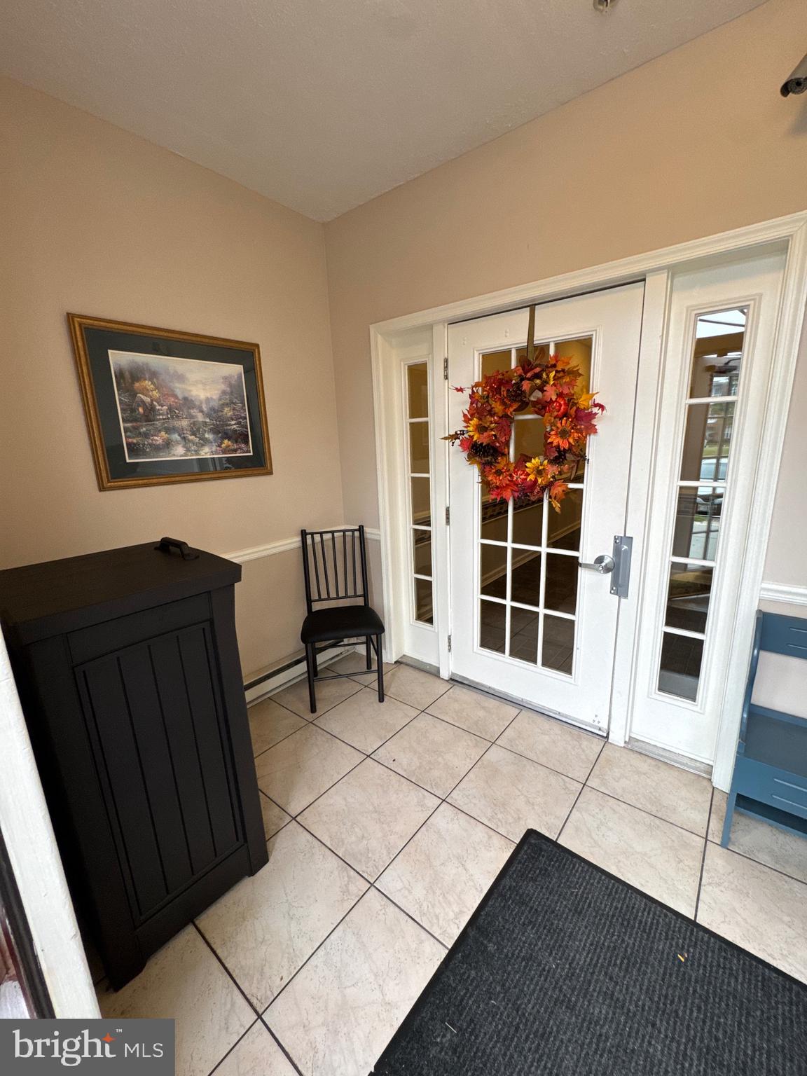 5144 Brightleaf Court, Unit 5144 Rosedale, MD 21237 - Photo 2 of 47 a view of a livingroom with wooden furniture and windows