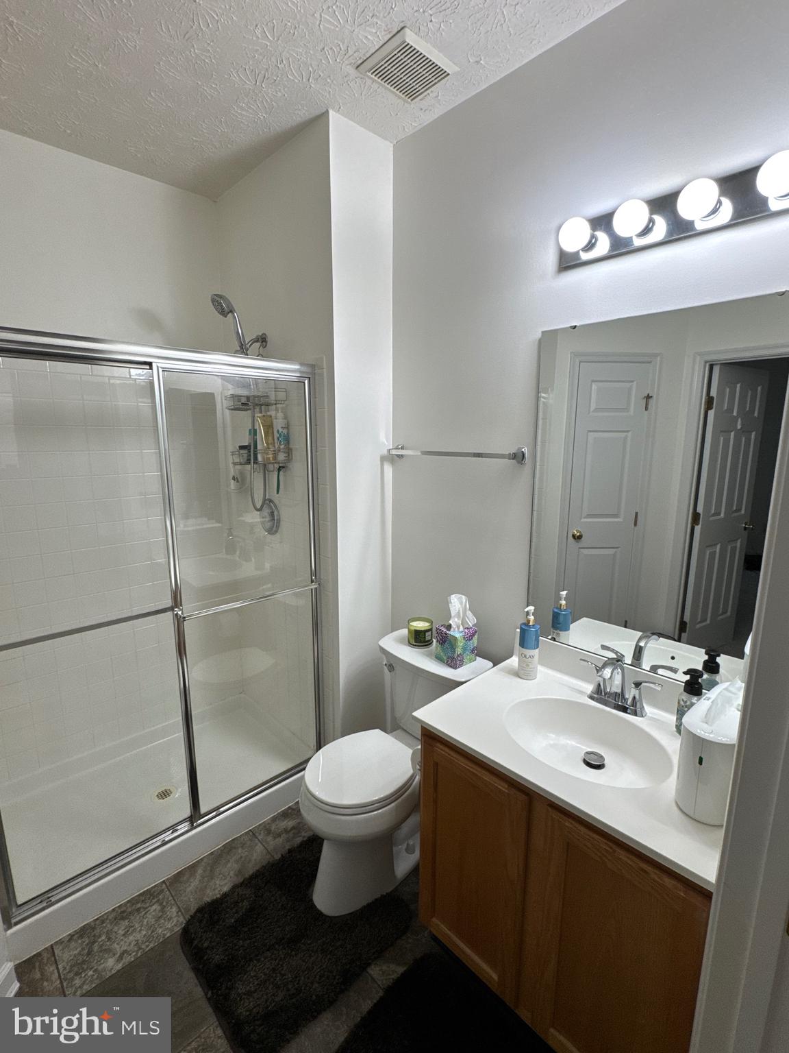 5144 Brightleaf Court, Unit 5144 Rosedale, MD 21237 - Photo 28 of 47 a bathroom with a sink toilet and shower