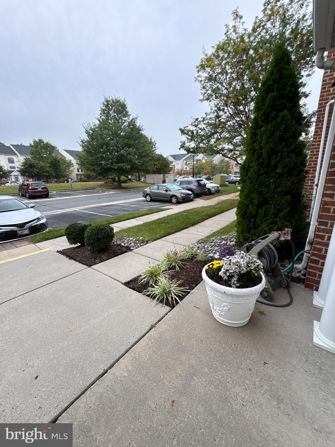 5144 Brightleaf Court, Unit 5144 Rosedale, MD 21237 - Photo 33 of 47 a view of a backyard with couple of potted plants